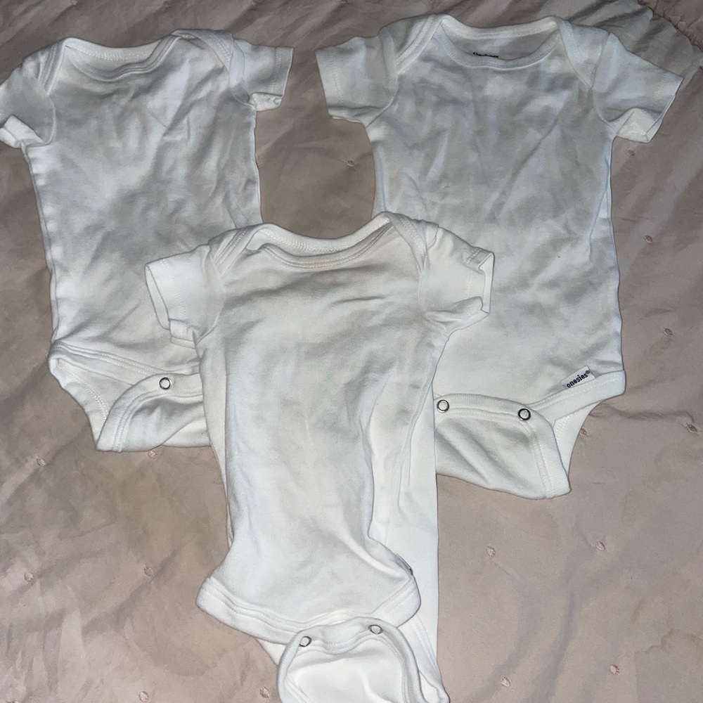 Three 0-3 month white onesies